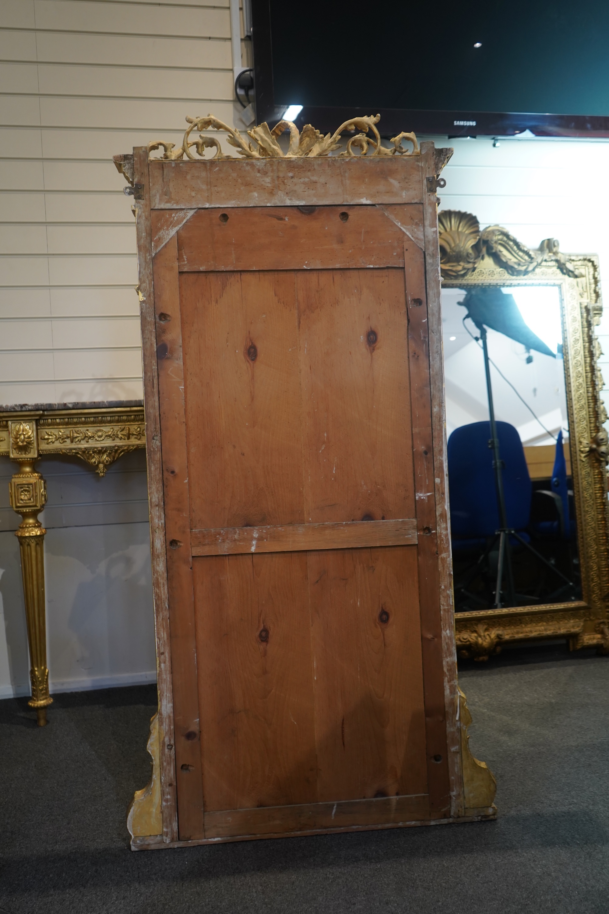 A pair of Louis XVI style giltwood and composition marble topped pier tables and mirrors